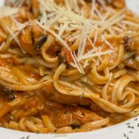 Blackened Chicken Pasta · Linguini noodles with mushrooms and chicken in a blackened cream sauce
