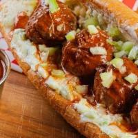 The Spicy Buffalo Meatball · Pop's meatballs topped with buffalo sauce and ranch dressing.
