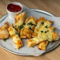 Baked Cheese Sticks · Dough made from scratch in-house daily brushed with garlic butter and topped with mozzarella...