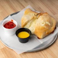 Cheese Calzones · Our made from scratch dough baked with ricotta, mozzarella cheese, and marinara on the side....