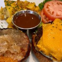 B&B Impossible Burger · Grilled Impossible burger on Pretzel bun with Vegan cheddar, Onion jam, Smokey Chipotle Ketc...