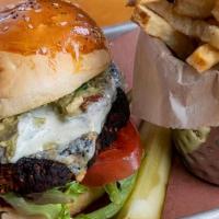 Spicy Black Bean Burger · Made with a chipotle black bean patty, pepper jack cheese, guacamole, lettuce, tomato, and j...