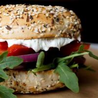 Bakehouse Veggie  · Roasted Red Pepper, Red onion, Tomatoes, and Arugula with Veggie cream cheese on a everythin...