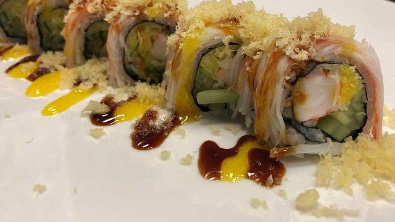 Cherry Blossom Roll (8) · Shrimp, cucumber, mango inside, topped with crabmeat, crunch with eel sauce and mango sauce.