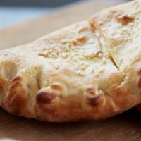 Cheese Maniac Calzone · Loaded with Fresh Mozzarella, Wisconsin Cheese Blend & Cheddar. Pick Stromboli (sauce on the...