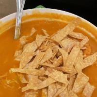 Chicken Tortilla Soup · A flavorful and spicy soup of seasoned chicken with fresh avocado, cilantro and crispy corn ...