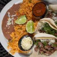 Mexico City Steak Tacos · Street-style tacos stuffed with fajita beef on corn tortillas, served with chopped onions, c...