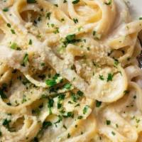 Fettuccine Alfredo · Cream, parmesan, and parsley.