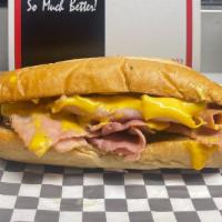 Ham Melt Grilled · Thin-sliced ham with your choice of cheese on our fresh baked hoagie bun with garlic & herb ...