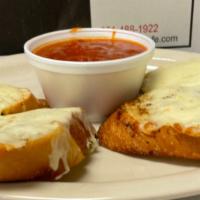 Garlic Cheese Bread · Four slices of John's fresh baked bread with garlic & herb butter and mozzarella cheese. For...