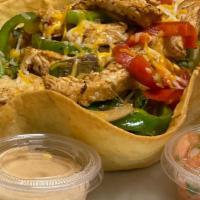 Chicken Fajita · Grilled chicken fajita with onions and red and green bell peppers, lettuce, Cheddar in a flo...