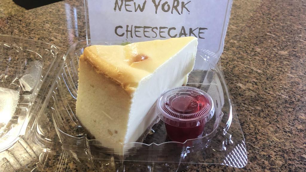 Sky High New York Cheesecake · An individual portion of our delicious new York style cheesecake served with a dollop of cherry pie filling and graham crust.