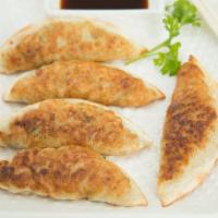 Dumplings · Small dough with veggie filling. Pan fried with little oil.