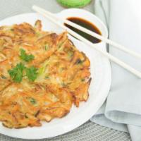 Korean Veggie Pancake · Crispy and savory pancake. Made with potato, cabbage, zucchini, onions, carrots and green on...