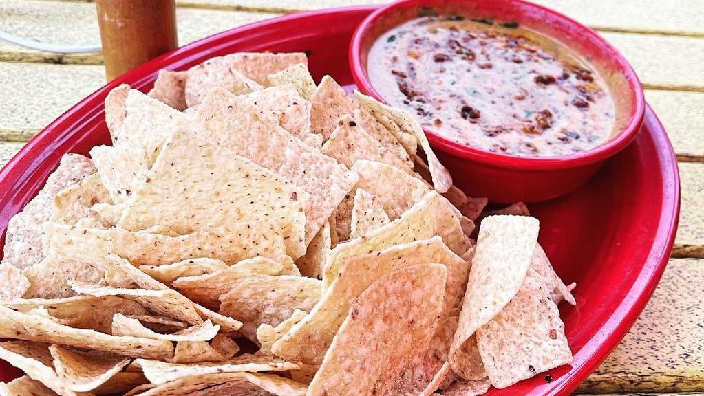 Chili Queso · With chips and salsa. Cup, bowl.