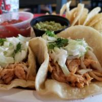 Soft Bbq Tacos · Three soft tacos stuffed with choice of pulled pork, brisket, or BBQ chicken topped with cre...