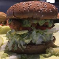 Guacamole Burger · Freshly made guacamole, lettuce, tomato, pepper jack cheese, topped with green chile spokes.