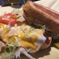 Grilled Cheese Burger · We smash your burger between two grilled cheese sandwiches with lettuce, tomatoes, Jamaican ...