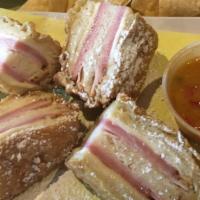 Flatire Monte Cristo · Smoked ham, sliced turkey breast, swiss cheese on a triple laid french white bread, battered...