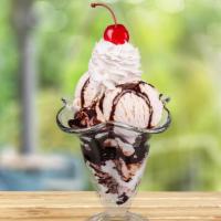 Hot Fudge Sundae · Two scoops of vanilla ice cream topped with hot fudge, whipped cream and a cherry.