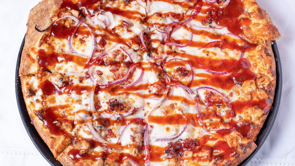 Bbq Chicken Pizza · Signature cream cheese sauce, in-house pizza sauce, grilled chicken, onions, crispy bacon, and BBQ sauce drizzle.