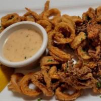 Calamari Fritti · Tender calamari, lightly breaded and fried. Served with our special sauce and lemon wedges.