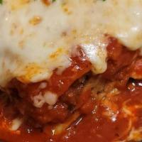 Lasagna Della Casa · Lasagna layered with ground beef, spinach, ricotta cheese, Béchamel sauce topped with Pomodo...