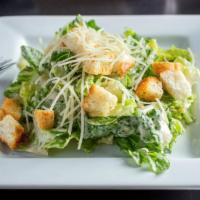 Caesar Salad · Crisp romaine lettuce topped with fresh-grated Parmesan cheese and homemade croutons and cre...