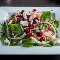 Cranberry Goat Cheese Salad · Baby spinach and arugula with dried cranberries, red onion, roasted almonds and crumbled goa...