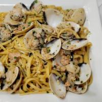 Linguine Alle Vongole · Linguine pasta cooked with premium wild caught clams, white wine, olive oil, oregano and red...