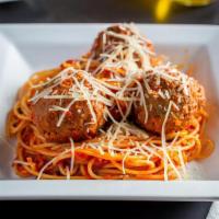 Spaghetti Con Polpette · Spaghetti in a marinara sauce accompanied with three giant homemade meatballs and topped wit...