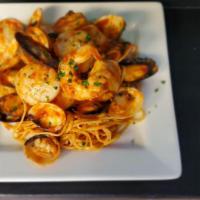 Linguine Frutti Di Mare · Premium wild-caught clams, shrimp, scallops and mussels cooked in white wine, served over li...