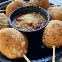 Mozz & Mari Balls · Fried dough stuffed with gooey mozzarella and served with warm house marinara, served 6 to a...