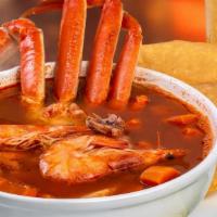 Sopa De Mariscos · Soup with different fish and catch includes fish, shrimp, squid and crab legs.