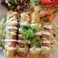 Flautas · Three rolled tortillas stuffed with chicken and deep fried. Garnished with lettuce, salsa, c...