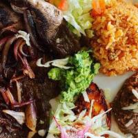 Bistec Tampiquena · Steak cooked with sauteed onions and served with a red sauce enchilada with lettuce, fresh g...