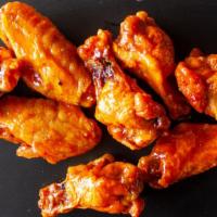 Wings · Traditional bone in wings tossed in your choice of: Buffalo, Hot Honey, Asian Sesame, or Spi...