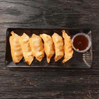Fried Shrimp & Pork Dumplings · Six fried to perfection dumplings filled with pork, shrimp, and chives paired with our spicy...