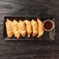 Fried Pork Dumplings · Six fried to perfection pork dumplings paired with our spicy yuzu sauce.