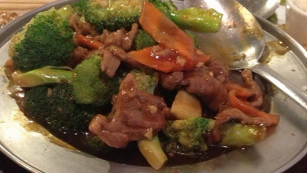 Broccoli Beef · Fresh broccoli and carrots brighten up the color to tender slices of beef sautéed in our chef's sauce. One of the house's popular dishes.