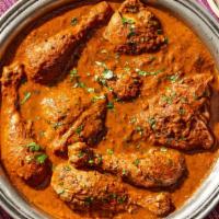 Curry Chicken · chicken stewed in a curry based sauce with two side dishes