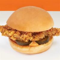 Spicy Chicken Sandwich · Spicy chicken sandwich with pickles and mayo on a bun.