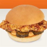 Classic Chicken Sandwich · Fried chicken sandwich with pickles and mayo on a potato bun