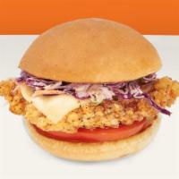 Deluxe Chicken Sandwich · Fried chicken sandwich with cheese, tomato, coleslaw, and mayo on a bun.