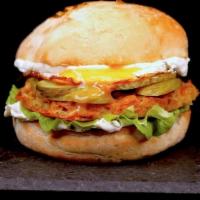 Bacon Ranch Chicken Sandwich Combo · Fried chicken sandwich with bacon, cheese,  tomato, lettuce, and ranch on a potato bun.  Ser...