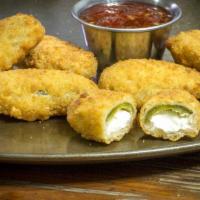 Stuffed Jalapeño · Juicy jalapeño poppers breaded and filled with cheese and fried to golden perfection.
