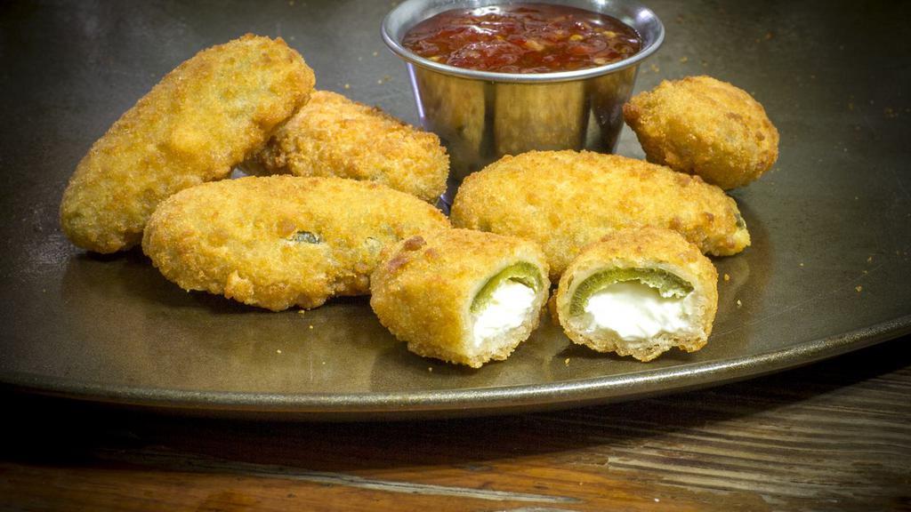 Stuffed Jalapeño · Juicy jalapeño poppers breaded and filled with cheese and fried to golden perfection.