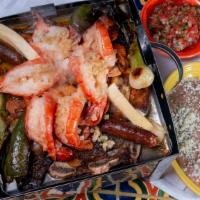 Parrillada De Lujo · Similar to the parrillada de carnes with the addition of 6 giant shrimp sauteed in garlic bu...