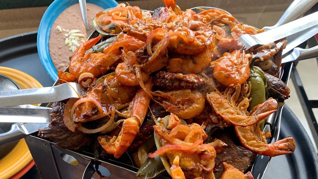 Parrillada Mar Y Tierra · Similar to the parrillada de carnes with an addition of a delicious seafood combination (