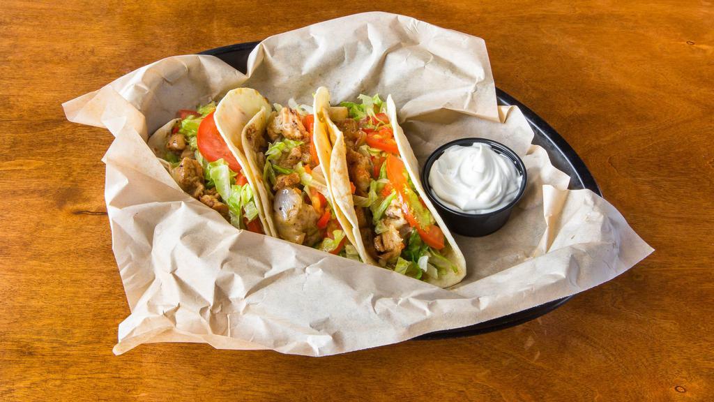 House Tacos · 3 flour tortillas with your choice of chicken or steak, grilled with onions, mushrooms & cheese. Topped with lettuce, tomato, & pepper relish. Try it with a side of sour cream!